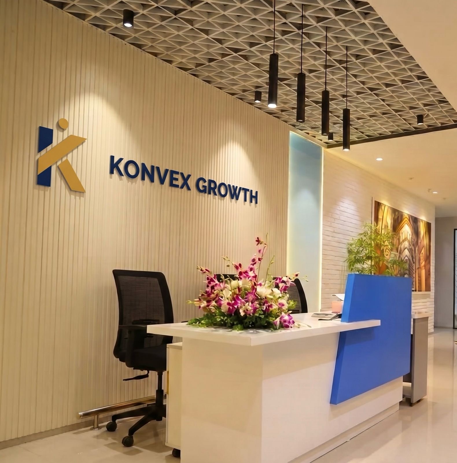 Konvex Growth office reception in Udyog Vihar, Gurugram, with the branded signage wall and welcome desk.